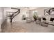 Spacious living area with a staircase, modern lighting, and stylish furniture at 2648 E Teakwood Pl, Chandler, AZ 85249