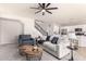 Comfortable living room featuring neutral tones, a ceiling fan, and an open floor plan at 2648 E Teakwood Pl, Chandler, AZ 85249