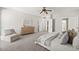 Large, open main bedroom featuring neutral tones, soft carpet and a cozy sitting area at 2648 E Teakwood Pl, Chandler, AZ 85249