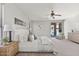 Bright main bedroom features neutral tones, a ceiling fan, and a sliding door to the backyard at 2648 E Teakwood Pl, Chandler, AZ 85249