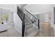 Staircase with black iron railing connecting the living area to the upper level of the home at 2648 E Teakwood Pl, Chandler, AZ 85249