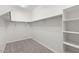 A well-organized walk-in closet with built-in shelving and ample storage space at 2648 E Teakwood Pl, Chandler, AZ 85249
