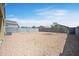 Large desert-landscaped backyard enclosed by a block fence, offering privacy at 30963 W Columbus Ave, Buckeye, AZ 85396