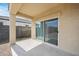 Covered patio with concrete flooring and view of a backyard with block fence at 30963 W Columbus Ave, Buckeye, AZ 85396