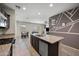 Kitchen with granite countertops, stainless steel appliances and an island including a sink and dishwasher at 30963 W Columbus Ave, Buckeye, AZ 85396