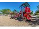 Colorful playground featuring a slide, climbing structures, and play areas, great for  at 30963 W Columbus Ave, Buckeye, AZ 85396