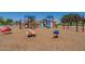 Fun playground featuring ladybug and bee spring riders on a soft, safe, woodchip surface at 30963 W Columbus Ave, Buckeye, AZ 85396