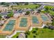 Aerial view of tennis courts, surrounded by landscaping, offering recreational opportunities for residents at 30963 W Columbus Ave, Buckeye, AZ 85396