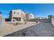 Spacious backyard featuring low maintenance landscaping, perfect for outdoor gatherings and relaxation at 36085 W Prado St, Maricopa, AZ 85138