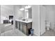 The bathroom features a double sink vanity with dark wood cabinets and a separate toilet room at 36085 W Prado St, Maricopa, AZ 85138