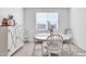 Bright dining area featuring white furniture, tile flooring and natural light at 36085 W Prado St, Maricopa, AZ 85138