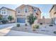 Beautiful home featuring well-maintained landscaping with decorative rock, shrubs, and mature trees at 36085 W Prado St, Maricopa, AZ 85138