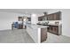 Kitchen showcasing stainless steel appliances, granite countertops and an expansive center island at 36085 W Prado St, Maricopa, AZ 85138