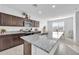 Kitchen featuring granite countertops, stainless steel appliances and breakfast area at 36085 W Prado St, Maricopa, AZ 85138