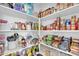 Walk-in pantry with plenty of shelving space for food storage and organization at 36085 W Prado St, Maricopa, AZ 85138