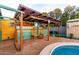 Inviting backyard patio featuring lounge seating under a covered porch with nearby pool at 3643 E Friess Dr, Phoenix, AZ 85032