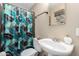 Bathroom featuring patterned shower curtain and a white sink at 3643 E Friess Dr, Phoenix, AZ 85032