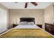 Bedroom featuring a ceiling fan and a large window providing natural light at 3643 E Friess Dr, Phoenix, AZ 85032