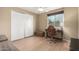 Bedroom with natural light featuring a ceiling fan and desk at 3643 E Friess Dr, Phoenix, AZ 85032