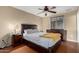 Cozy bedroom featuring a ceiling fan, and a large window for natural light at 3643 E Friess Dr, Phoenix, AZ 85032