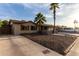 Well kept house with gravel landscaping, a mature tree and a two car garage at 3643 E Friess Dr, Phoenix, AZ 85032