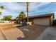Nice home with desert landscaping, mature trees, a large driveway, and a two car garage at 3643 E Friess Dr, Phoenix, AZ 85032