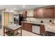 Kitchen featuring stainless steel appliances, dark wood cabinetry and island at 3643 E Friess Dr, Phoenix, AZ 85032