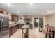 Bright kitchen with stainless steel appliances, center island, and dark wood cabinetry at 3643 E Friess Dr, Phoenix, AZ 85032
