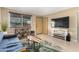 Comfortable living room boasts tile floors, stylish decor, a large window and modern furniture at 3643 E Friess Dr, Phoenix, AZ 85032