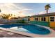 Tranquil in-ground backyard pool featuring clear blue water and mature landscaping around the yard at 3643 E Friess Dr, Phoenix, AZ 85032
