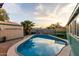 Private swimming pool surrounded by lush landscaping and a shed at 3643 E Friess Dr, Phoenix, AZ 85032