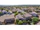 An aerial view showcases a beautiful neighborhood with mature trees at 3823 S 101St Dr, Tolleson, AZ 85353