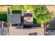 Aerial view shows a stylish backyard with a gazebo, outdoor kitchen, and patio area at 3823 S 101St Dr, Tolleson, AZ 85353