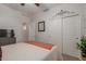 Well-lit bedroom offering a spacious closet, neutral tones, and inviting ambiance at 3823 S 101St Dr, Tolleson, AZ 85353