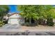Charming single-Gathering home with a well-maintained lawn, mature trees, and a two-car garage at 3823 S 101St Dr, Tolleson, AZ 85353