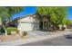 Charming single-story home features a well-manicured front yard and a two-car garage at 3823 S 101St Dr, Tolleson, AZ 85353