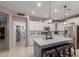 Modern kitchen with white cabinets, a large island, and stainless steel appliances at 3823 S 101St Dr, Tolleson, AZ 85353