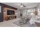 Inviting living room with a statement wall, stylish TV console, and comfortable seating area at 3823 S 101St Dr, Tolleson, AZ 85353