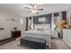 Serene main bedroom featuring a decorative accent wall, neutral tones, and ample natural light at 3823 S 101St Dr, Tolleson, AZ 85353