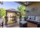 Enjoyable outdoor patio featuring a seating area with outdoor lighting at 3823 S 101St Dr, Tolleson, AZ 85353