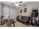 Versatile room featuring exercise equipment and a cozy seating area at 3823 S 101St Dr, Tolleson, AZ 85353