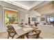 Open dining room with view of outdoors, light wood accents, and large windows at 39032 N 101St Way, Scottsdale, AZ 85262