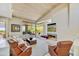 Bright living room features vaulted wood ceilings, modern fireplace, and large windows with views of the desert landscape at 39032 N 101St Way, Scottsdale, AZ 85262