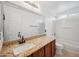Bathroom featuring granite countertops, a vanity, and a shower-tub combo at 4587 E Silverbell Rd, San Tan Valley, AZ 85143