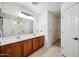 Bathroom with double sinks, a large mirror, and a view of the shower stall at 4587 E Silverbell Rd, San Tan Valley, AZ 85143