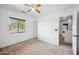 Bright bedroom with ceiling fan, natural light, and neutral carpeting at 4587 E Silverbell Rd, San Tan Valley, AZ 85143