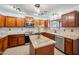 Modern kitchen featuring granite countertops, stainless steel appliances, and wooden cabinetry at 4587 E Silverbell Rd, San Tan Valley, AZ 85143