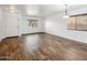 Bright living room featuring wood-look floors, neutral walls, recessed lights and ample natural light at 4587 E Silverbell Rd, San Tan Valley, AZ 85143