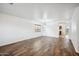 Bright and airy living room boasting wood-look floors, neutral walls, and recessed lighting at 4587 E Silverbell Rd, San Tan Valley, AZ 85143