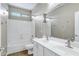 Bright bathroom featuring double sinks with white cabinets, tile floor, and shower-tub combo at 4647 E County Down Dr, Chandler, AZ 85249
